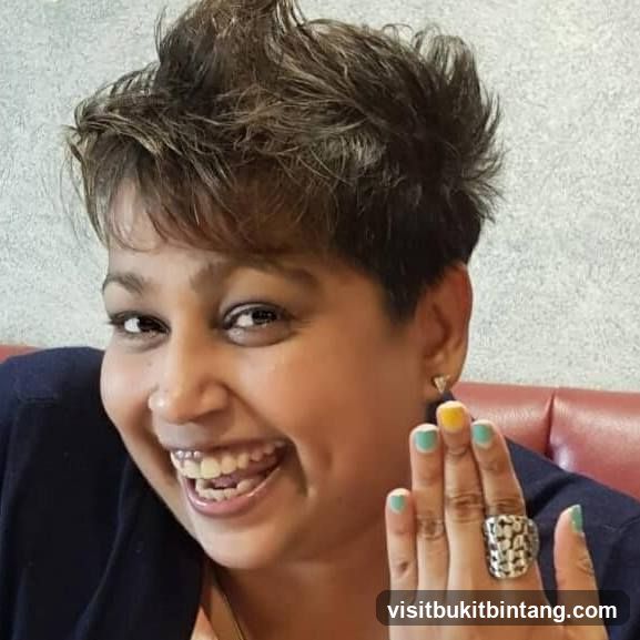 Woman smiling and showing her rings