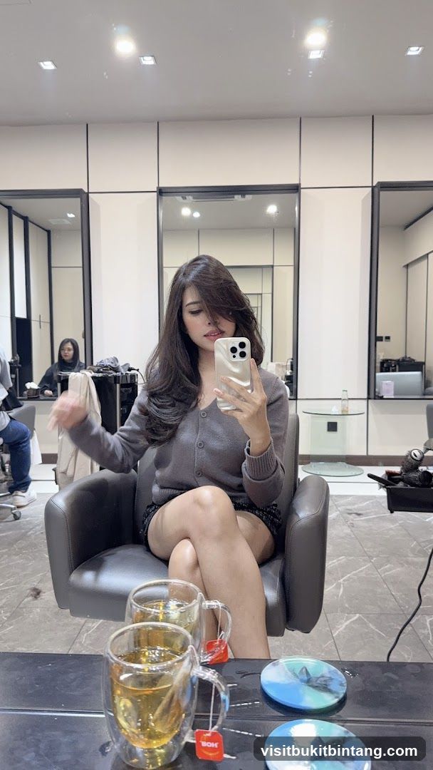 Woman taking a selfie in a salon