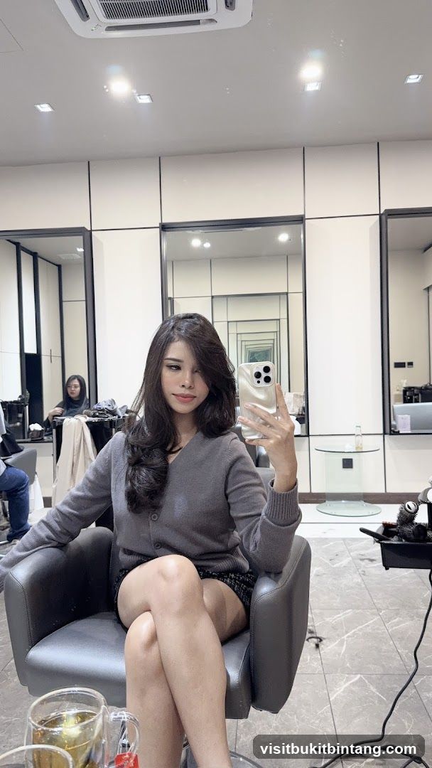 Woman taking a selfie in a salon