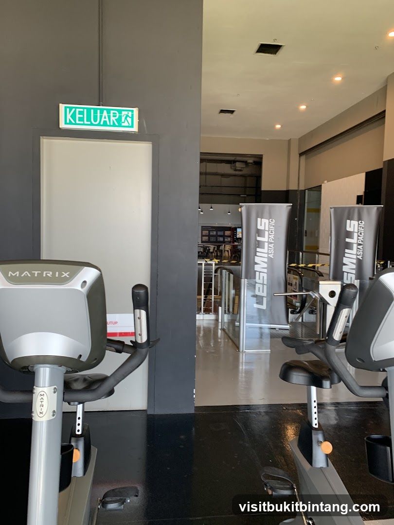 Gym Interior with Exercise Bikes and Banners