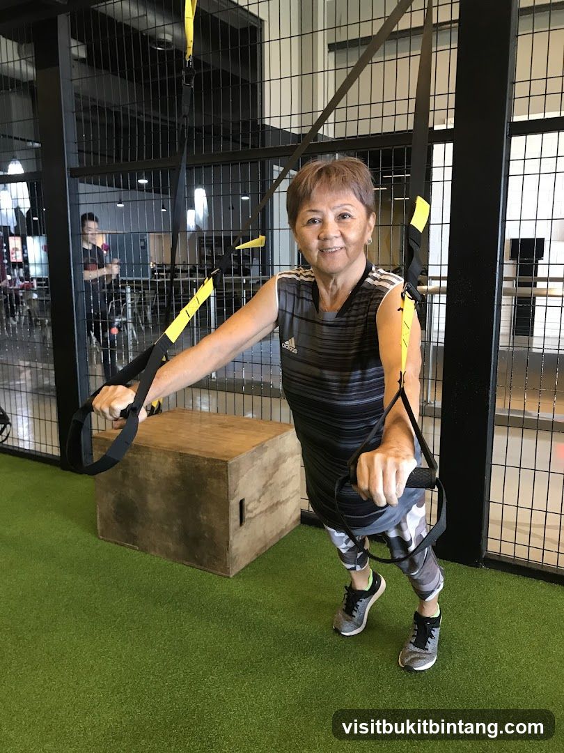 Woman exercising with suspension trainer