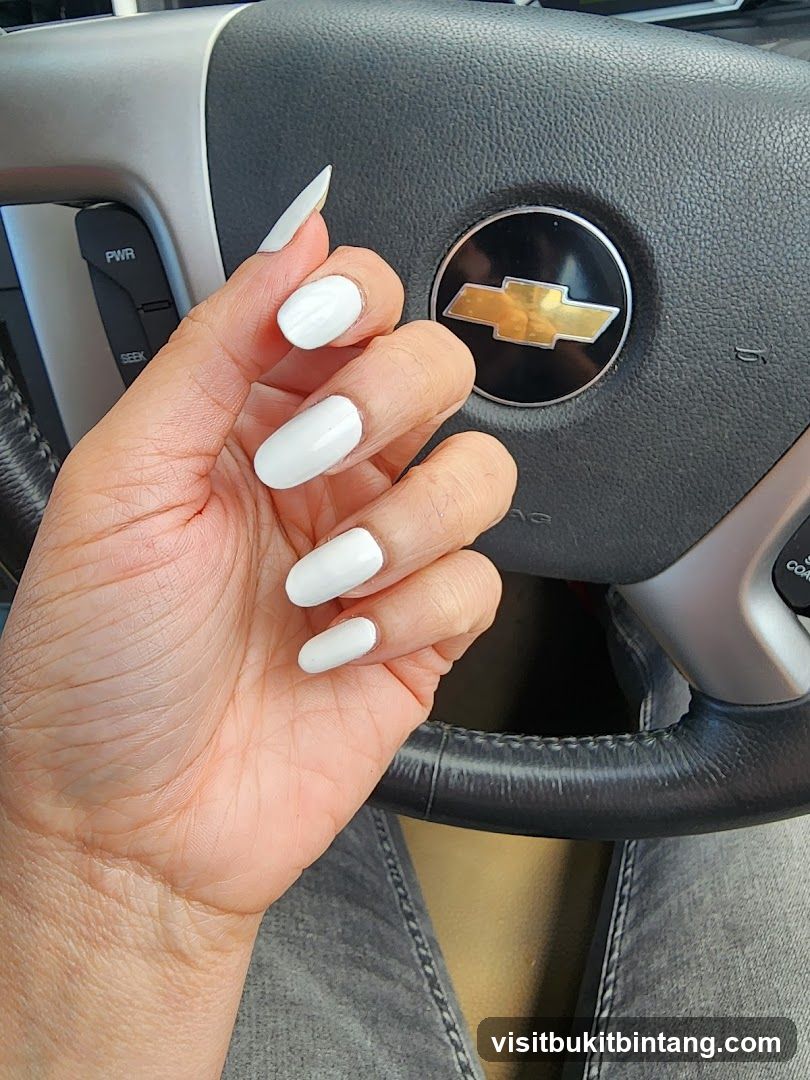 White Nails on Steering Wheel