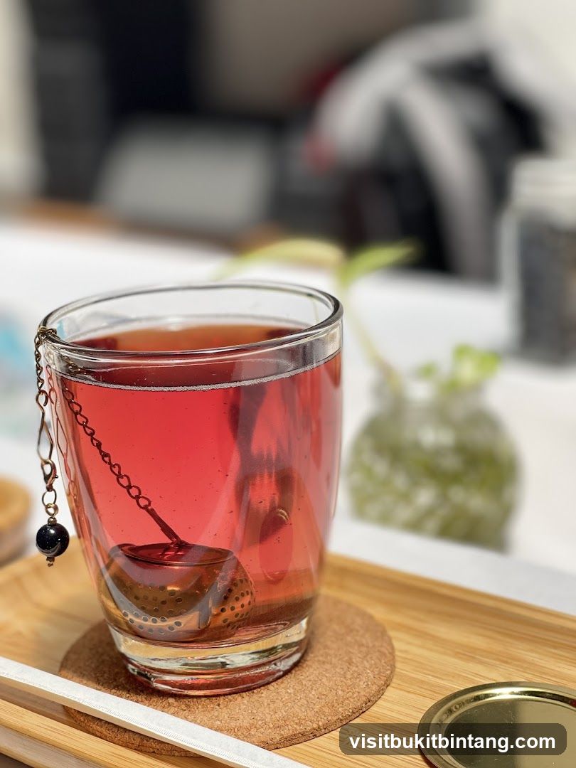 Glass of Red Tea with Tea Infuser