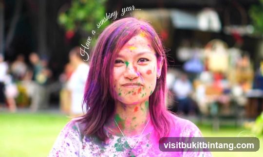 Woman covered in colorful powder