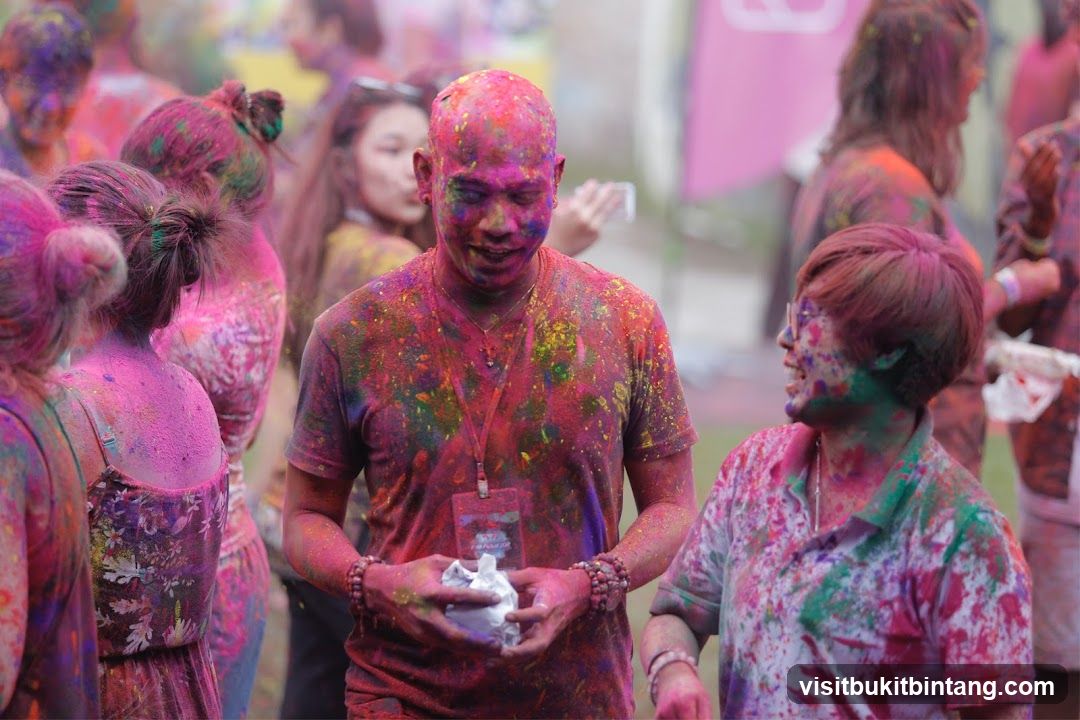People covered in colorful powder