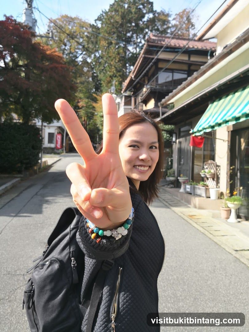 Woman making peace sign