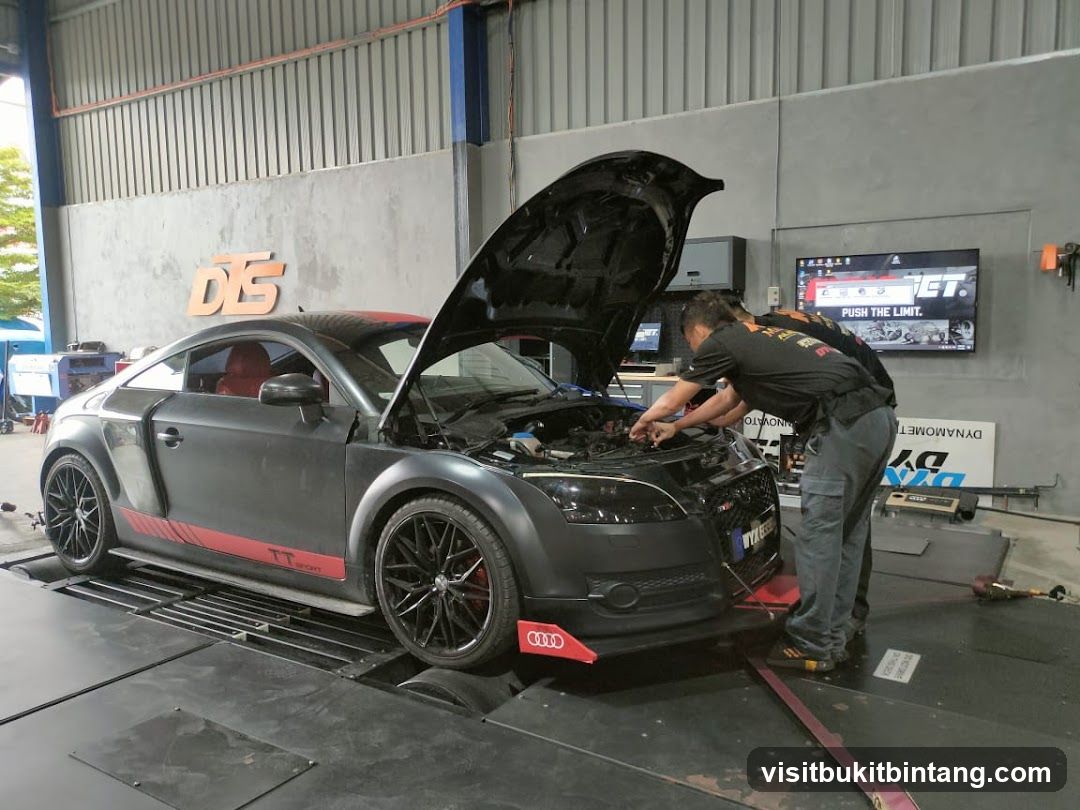 Car being serviced on a dynamometer