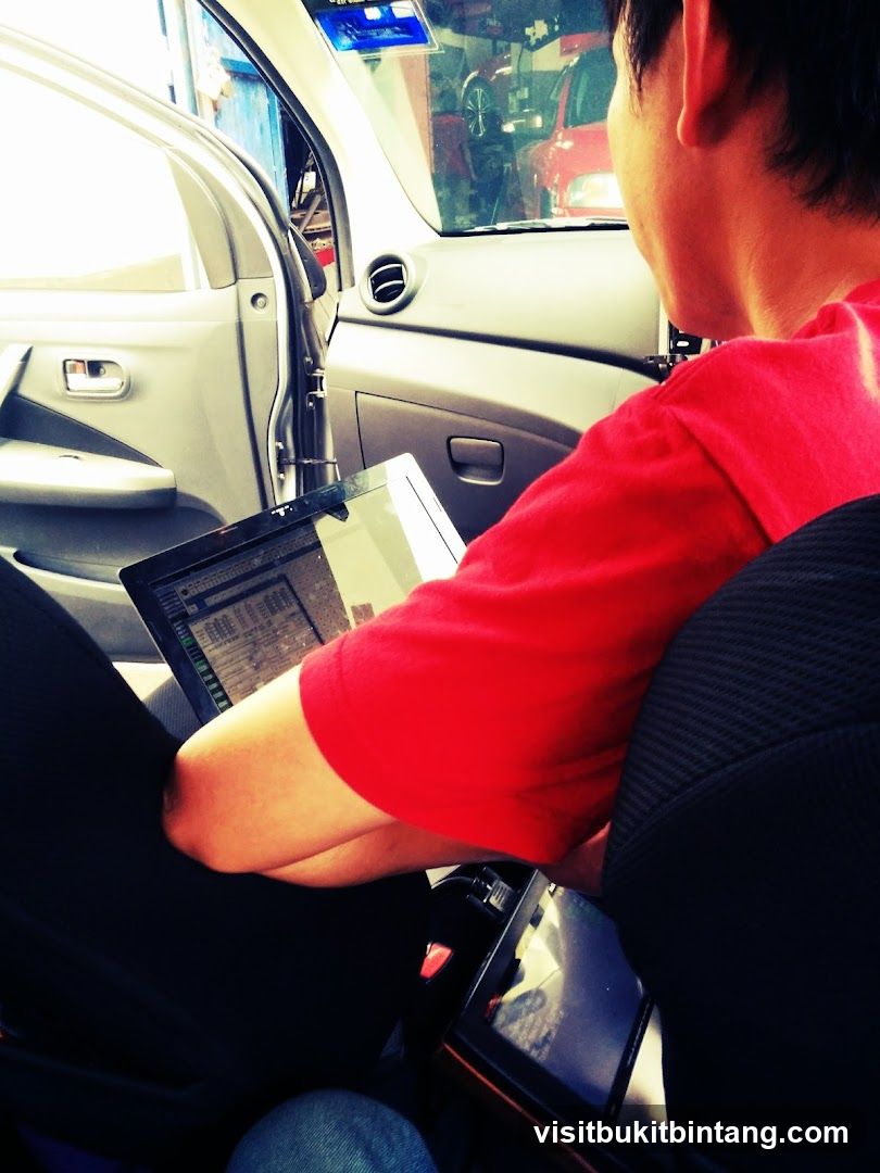 Person using laptop in car