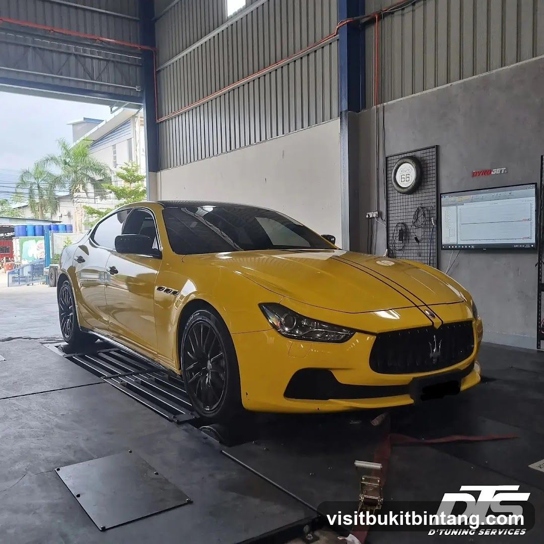 Yellow Maserati on a dynamometer