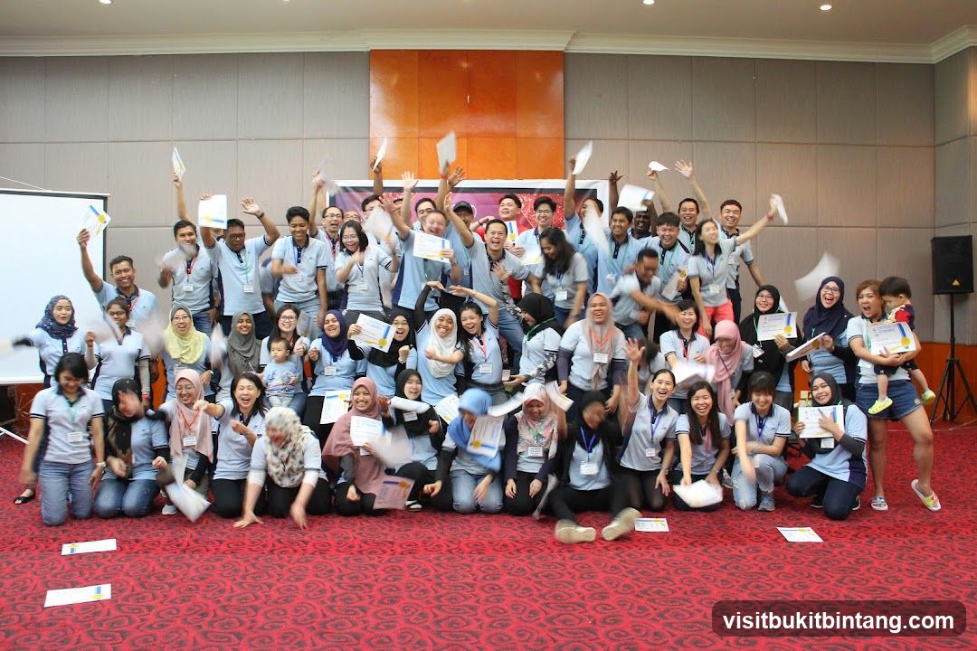 Group celebrating with certificates