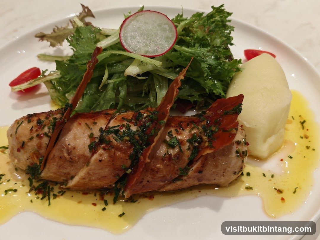 Chicken dish with mashed potatoes and salad