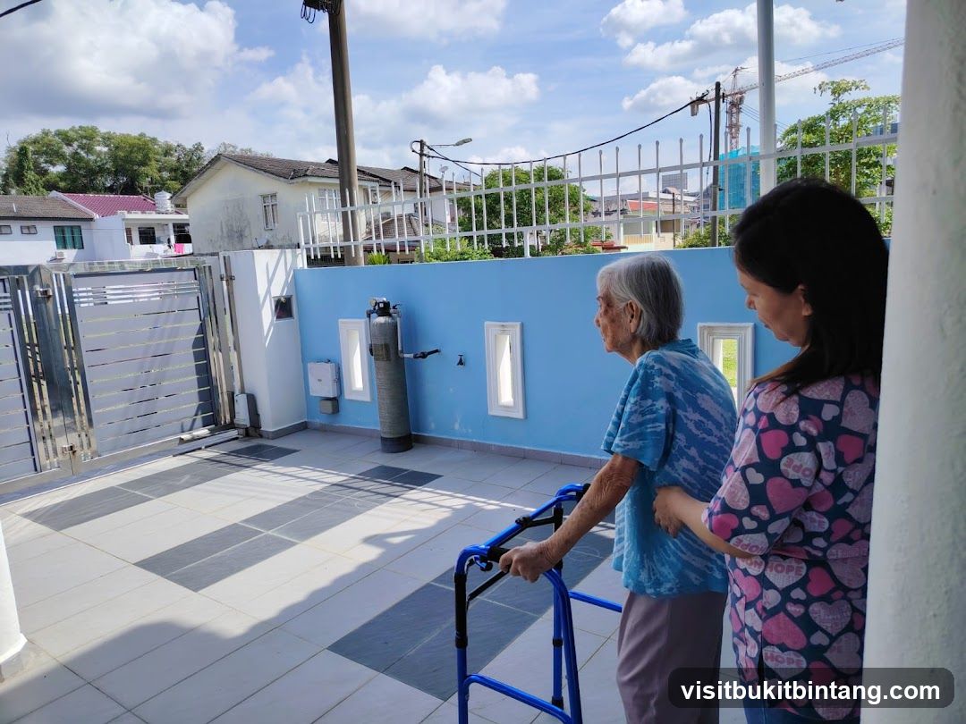 Elderly woman with walker and caregiver