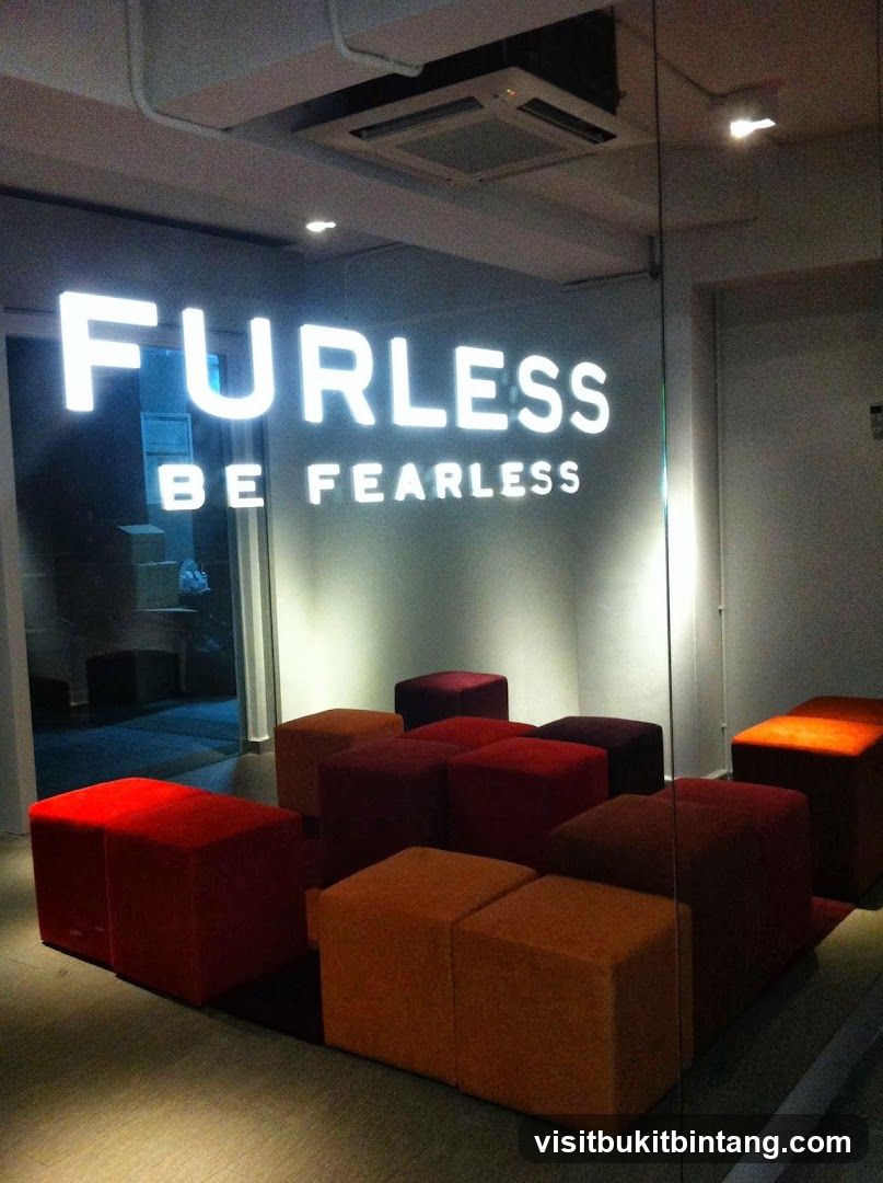 Interior with illuminated sign and seating