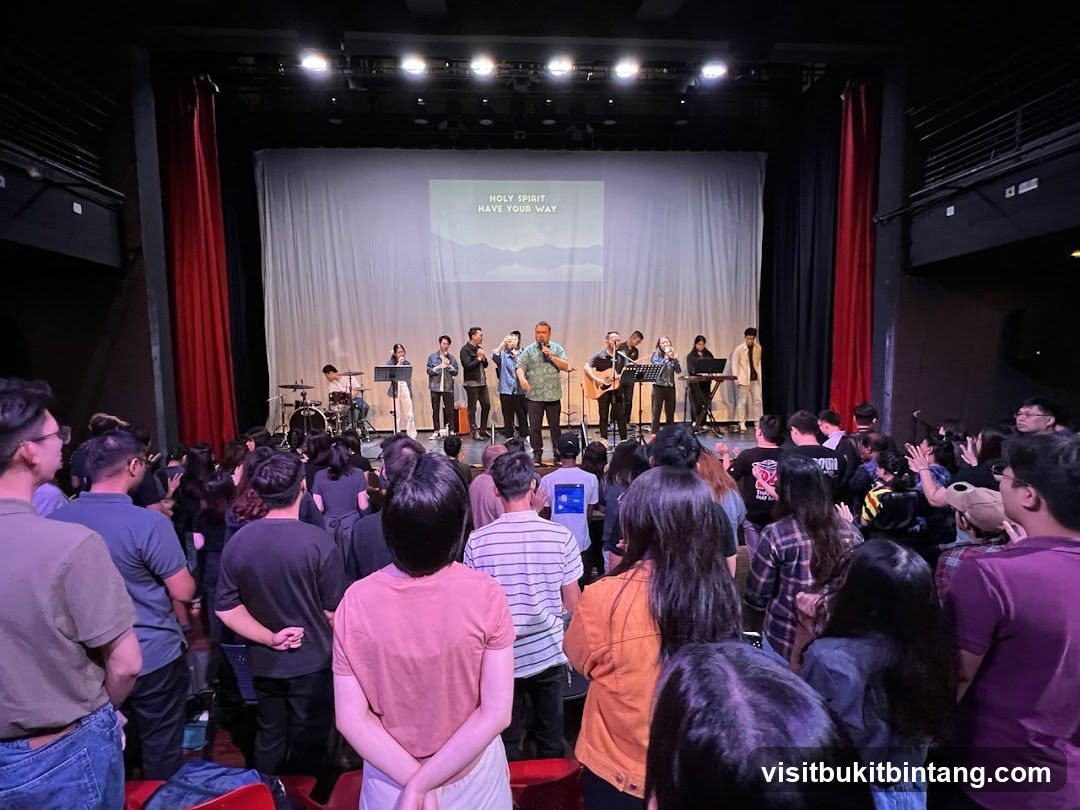 Congregation singing along to worship lyrics on screen