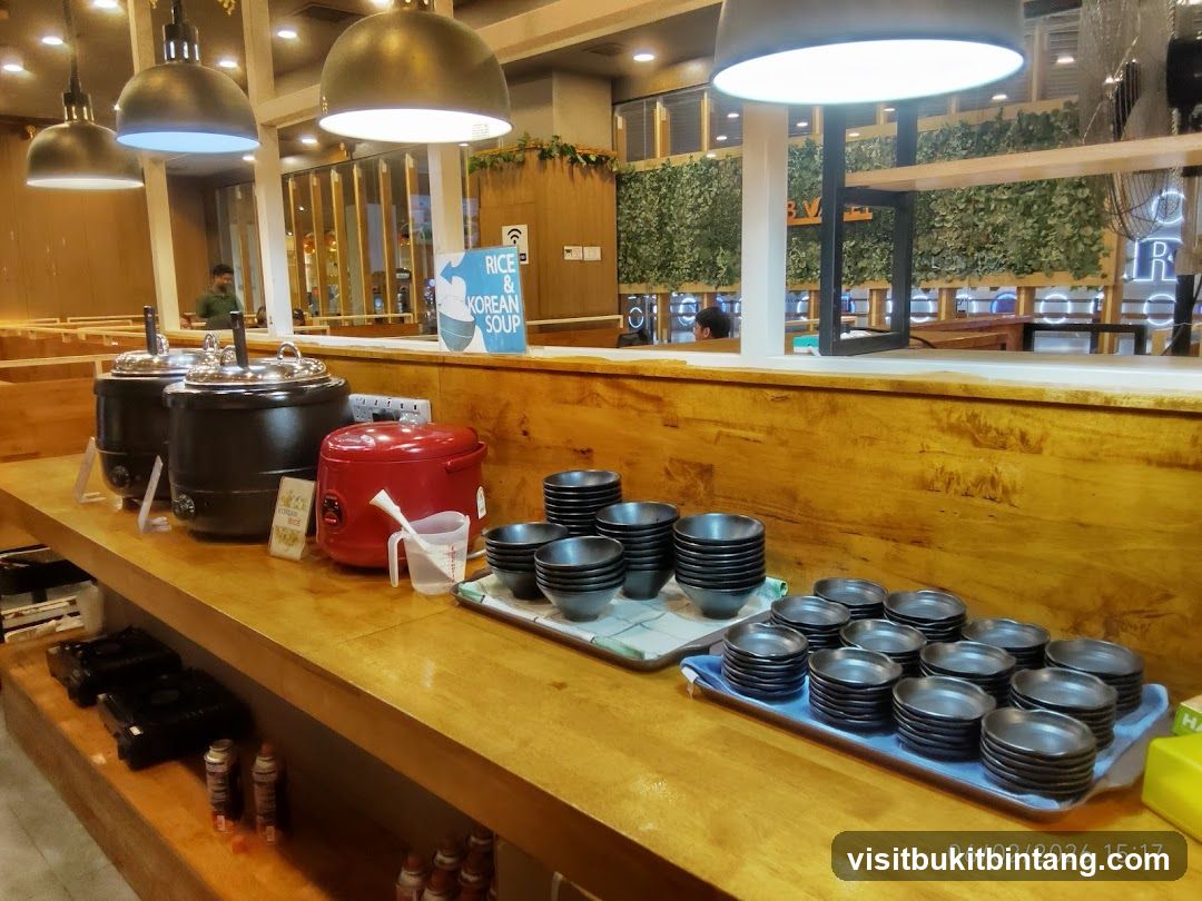 Buffet Setup with Korean Soup and Rice Station
