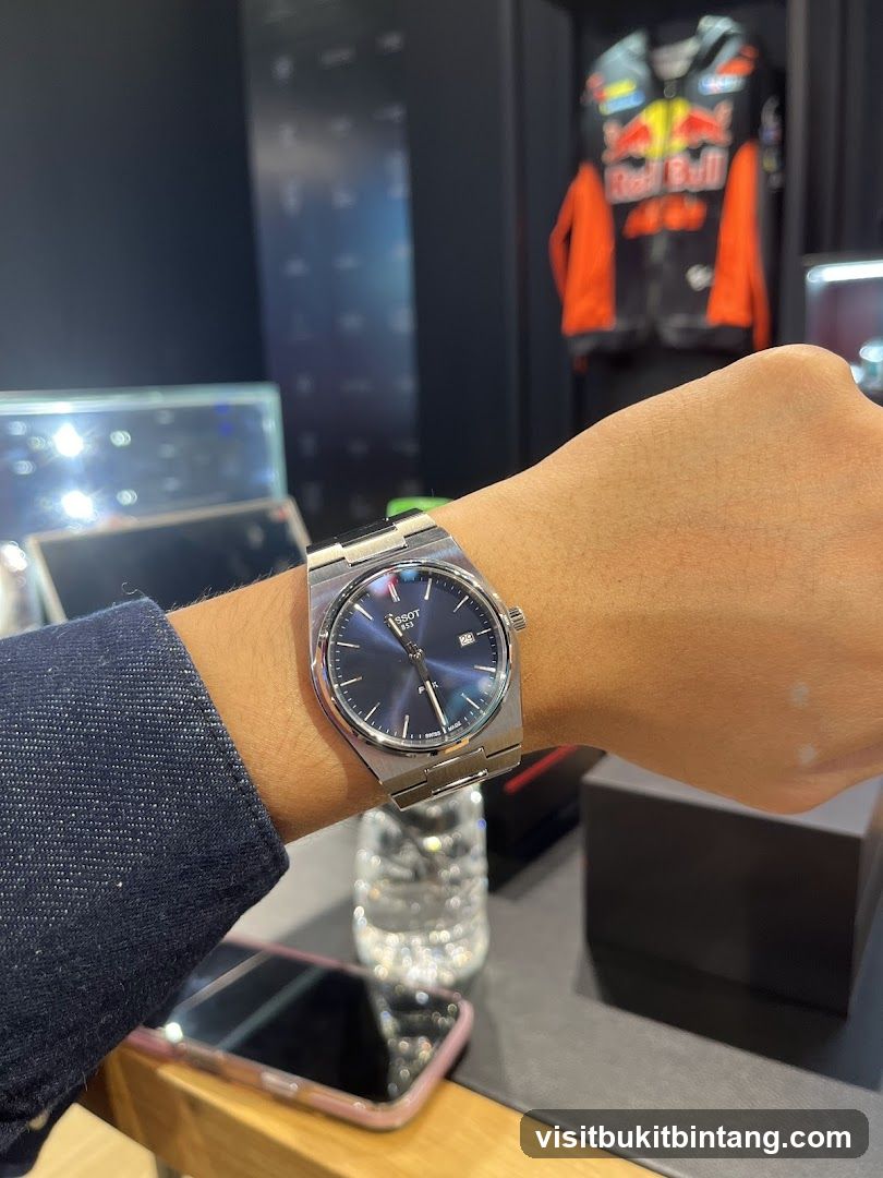 Watch on wrist with Red Bull jacket in background