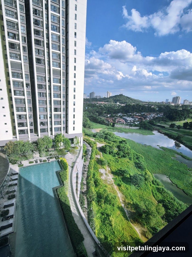 High-rise view with pool and greenery