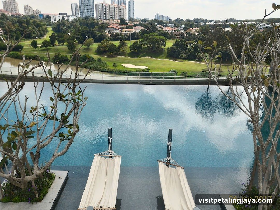 Poolside View with Golf Course and City Skyline