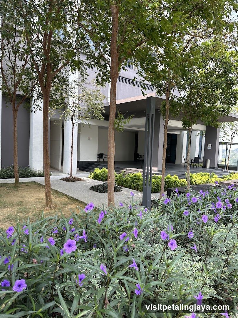 Modern Building Entrance with Purple Flowers