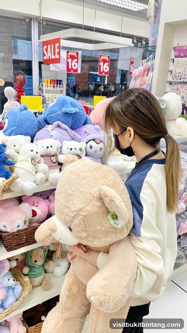 Woman holding a large teddy bear in a store