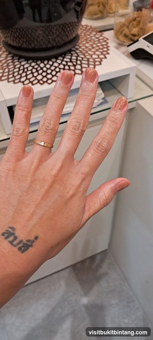Hand with freshly painted nails