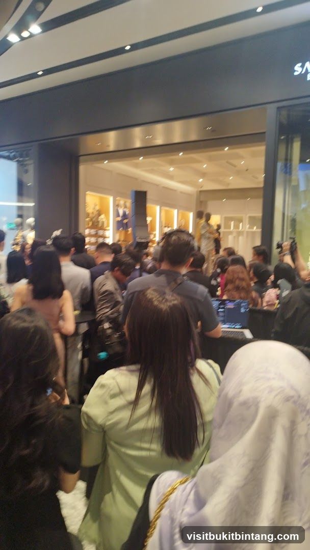 Crowd gathered in front of a store