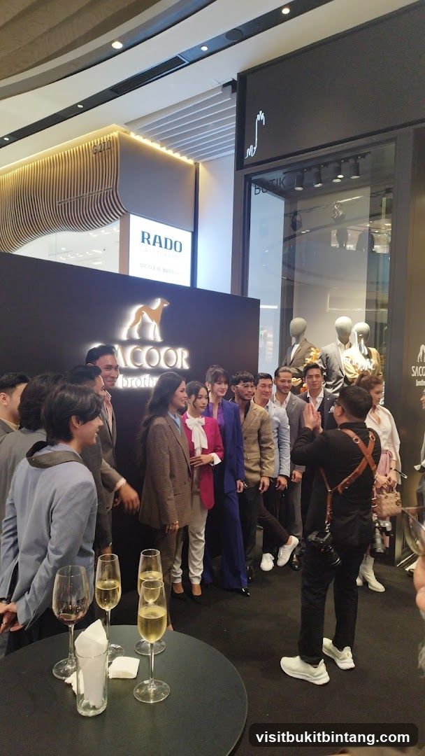 Group posing for a photo at a brand event