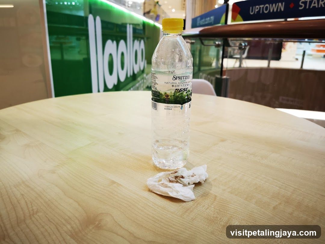 Empty water bottle on table