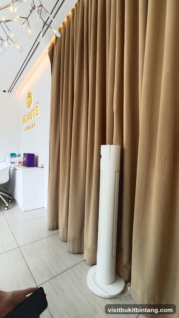 Interior of a salon with a logo and curtains