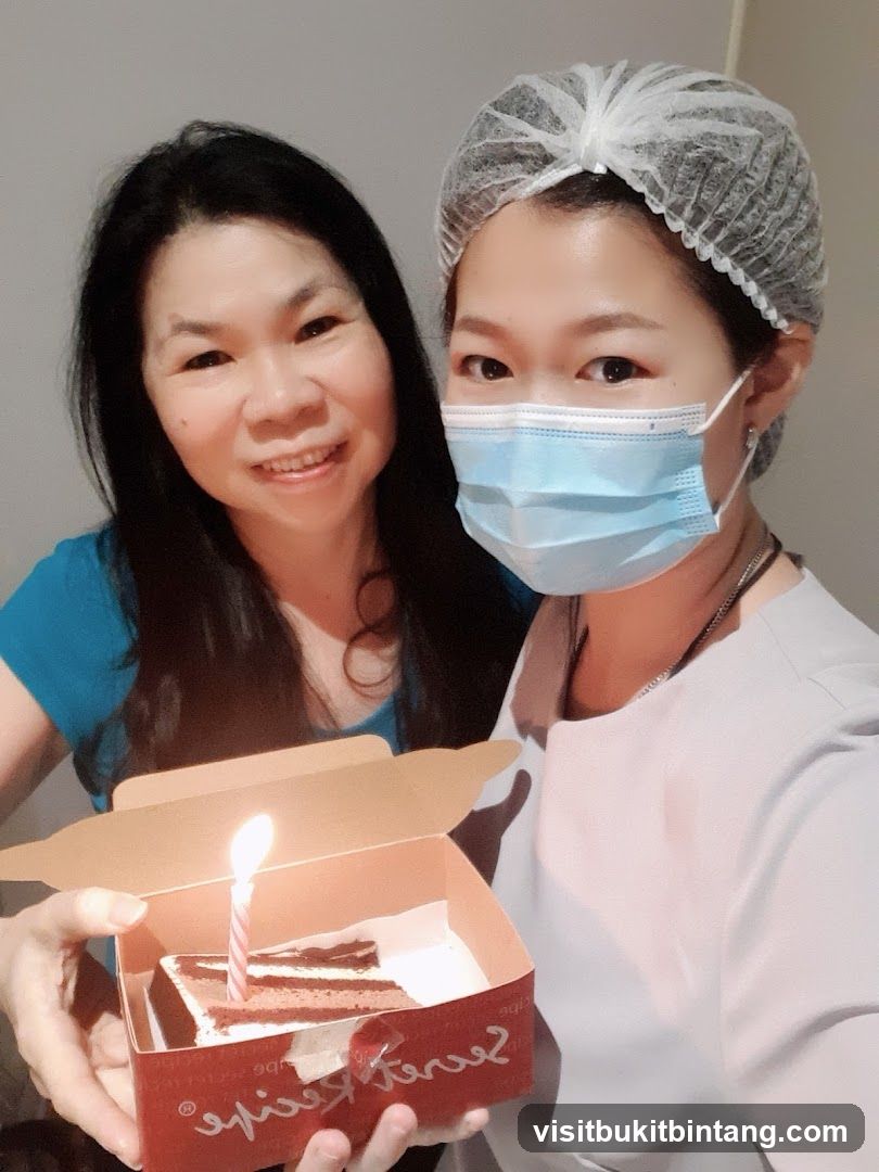 Two Women with a Birthday Cake