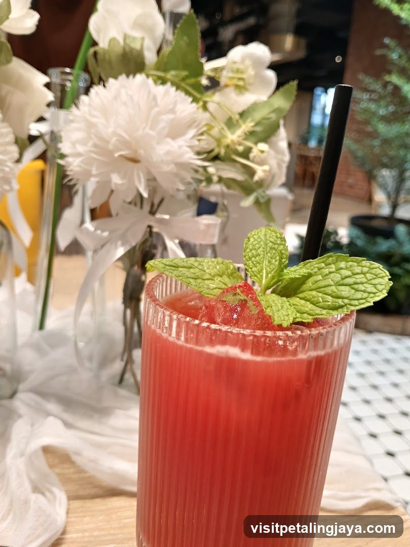 Red Drink with Mint Garnish