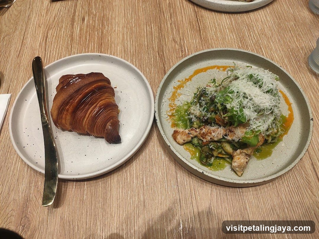 Croissant and Salad on Wooden Table