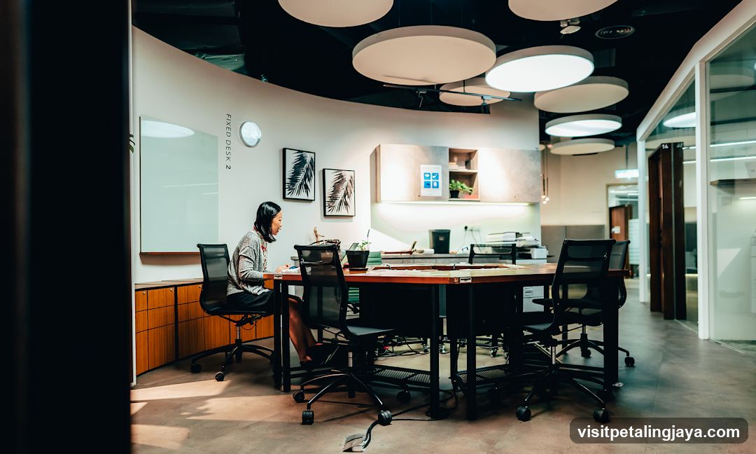 Modern Office Interior with Employee at Desk