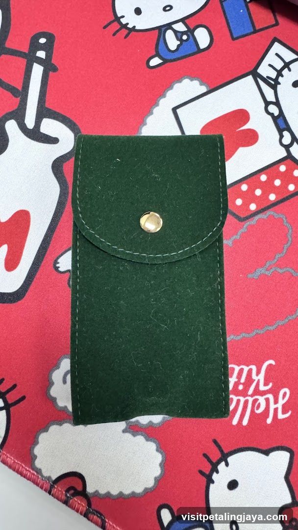 Green pouch on Hello Kitty fabric