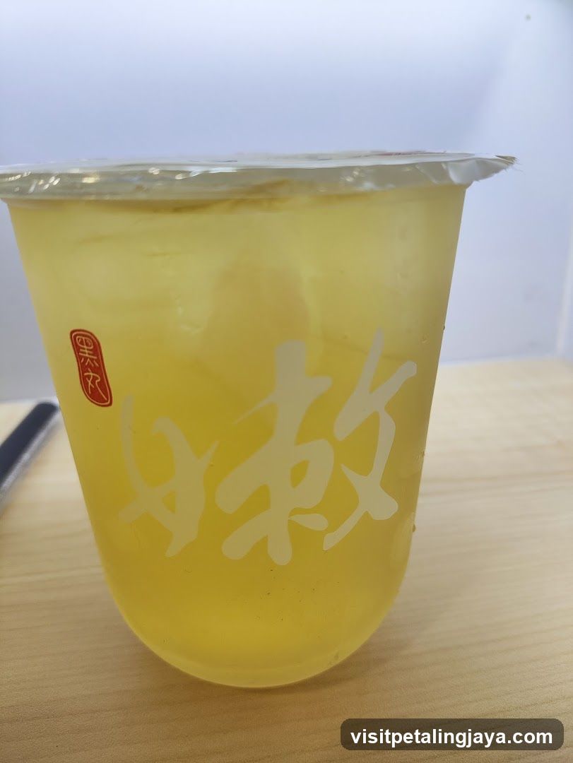 Yellow Iced Drink in Cup