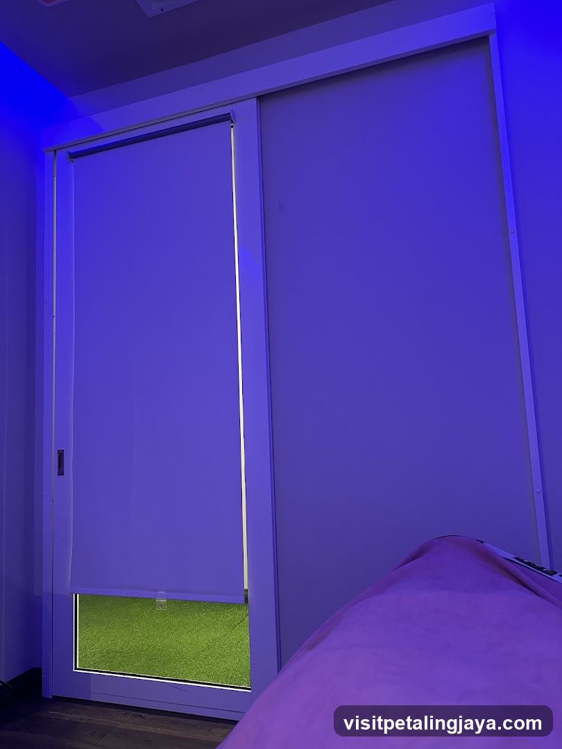 Purple-lit room with sliding door and blinds