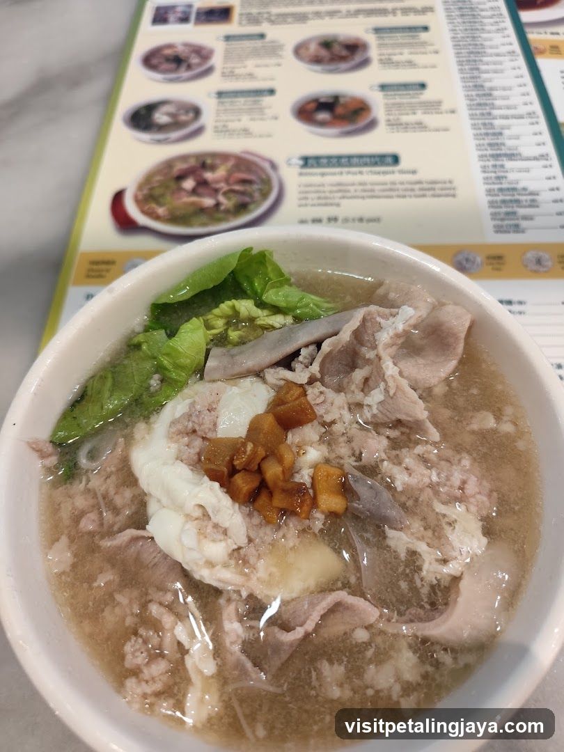 Bowl of Soup with Meat and Vegetables