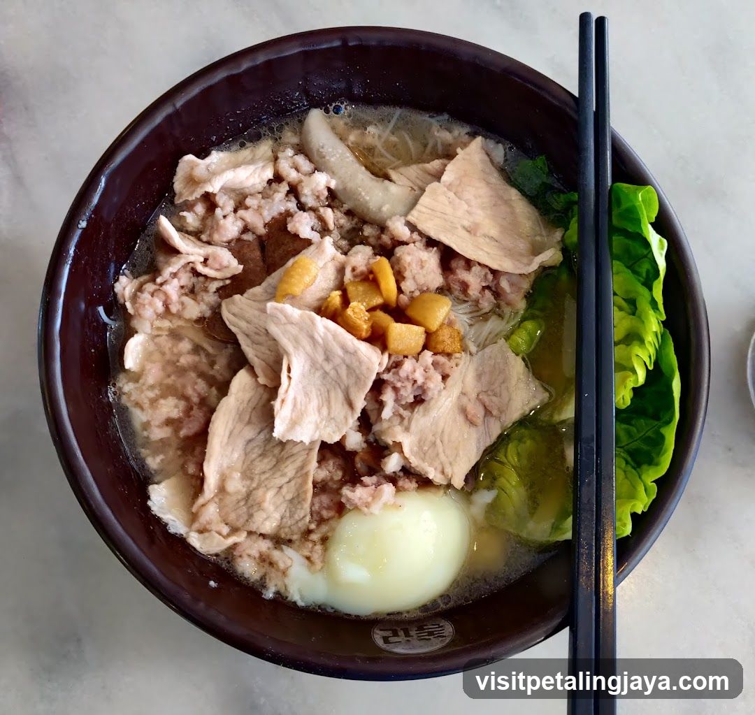 Bowl of Noodle Soup with Meat and Egg