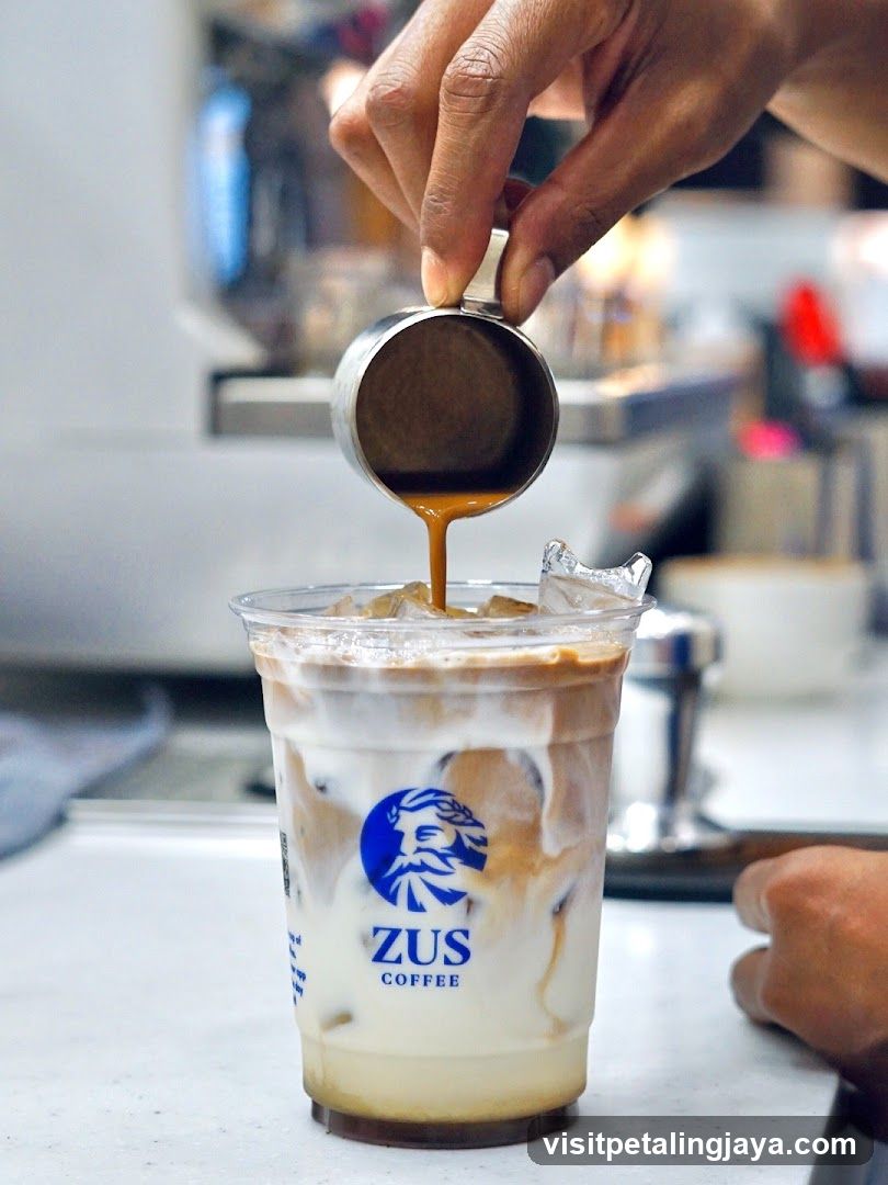 Pouring espresso into iced coffee