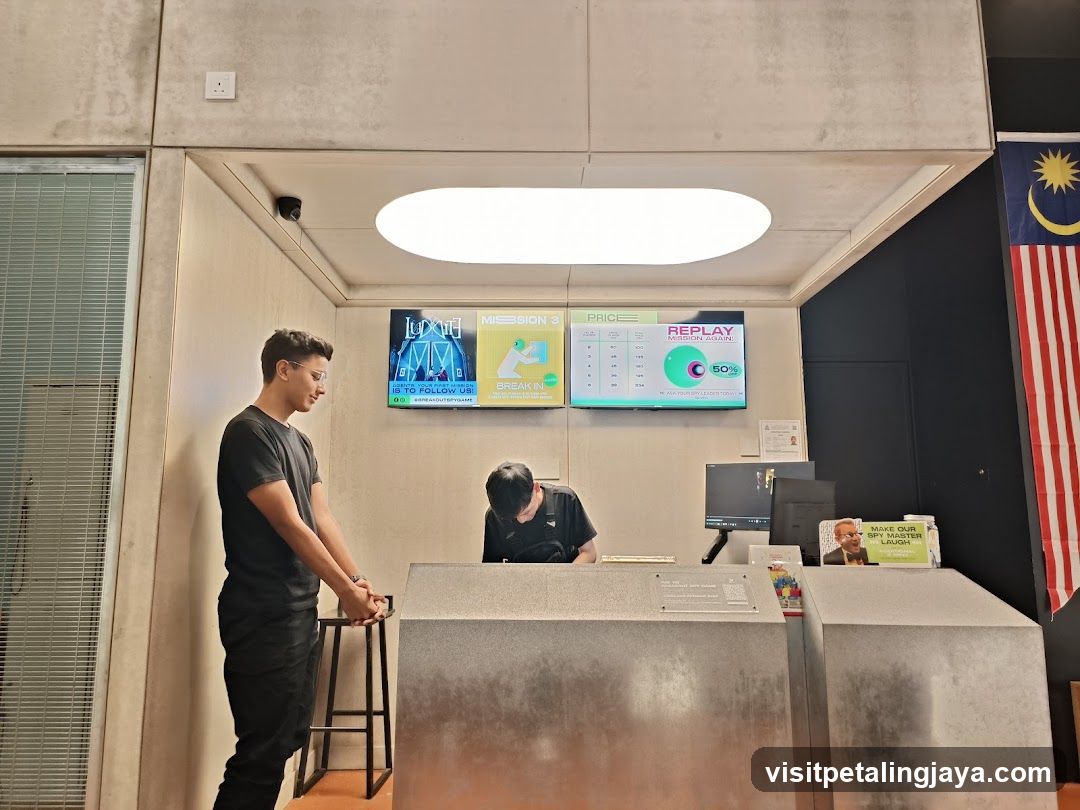 Reception Area with Staff and Digital Screens