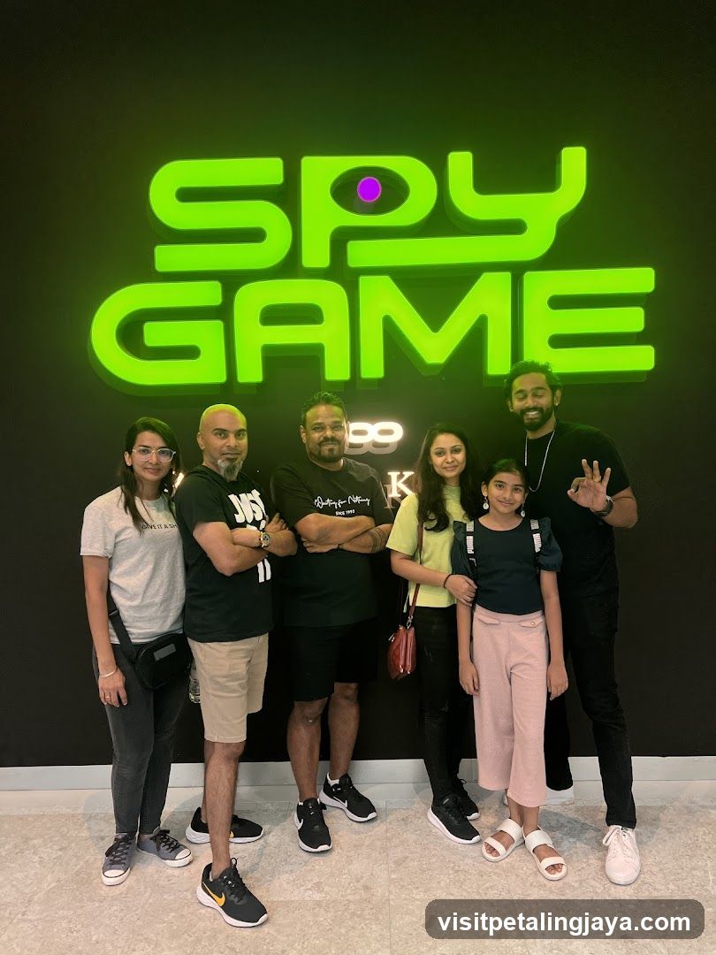 Group photo in front of Spy Game sign