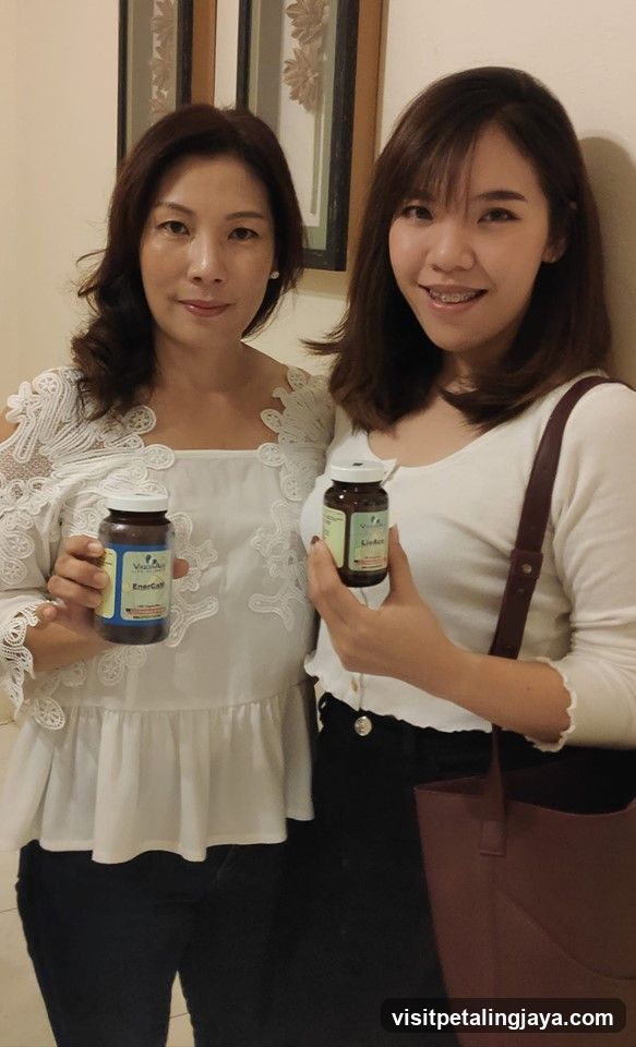 Two women holding supplement bottles