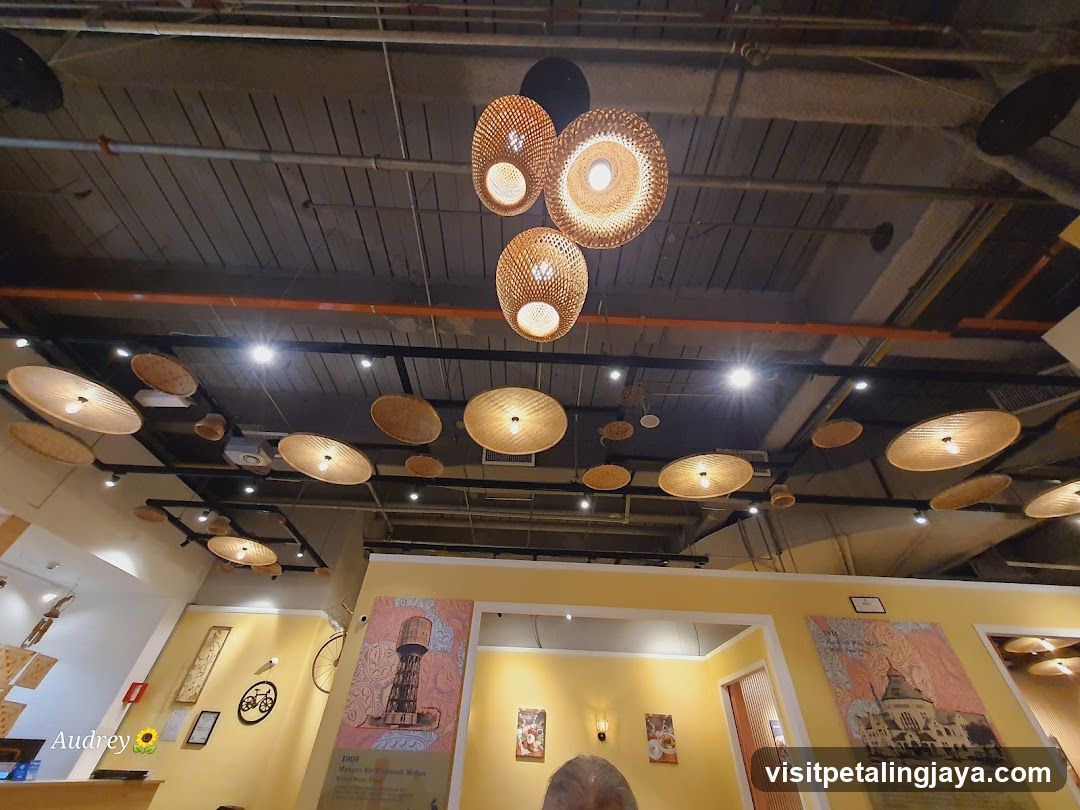 Interior with hanging woven lamps and wall art