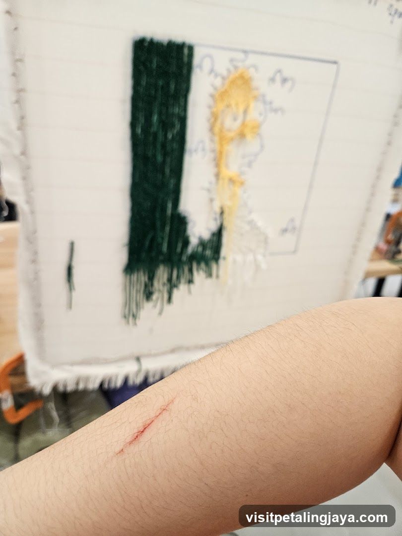 Scratched arm with embroidery in background