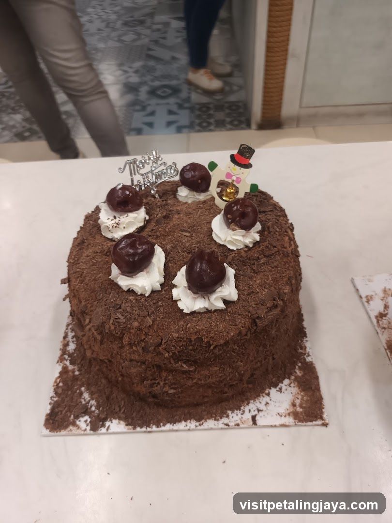 Chocolate Cake with Cherries and Snowman topper