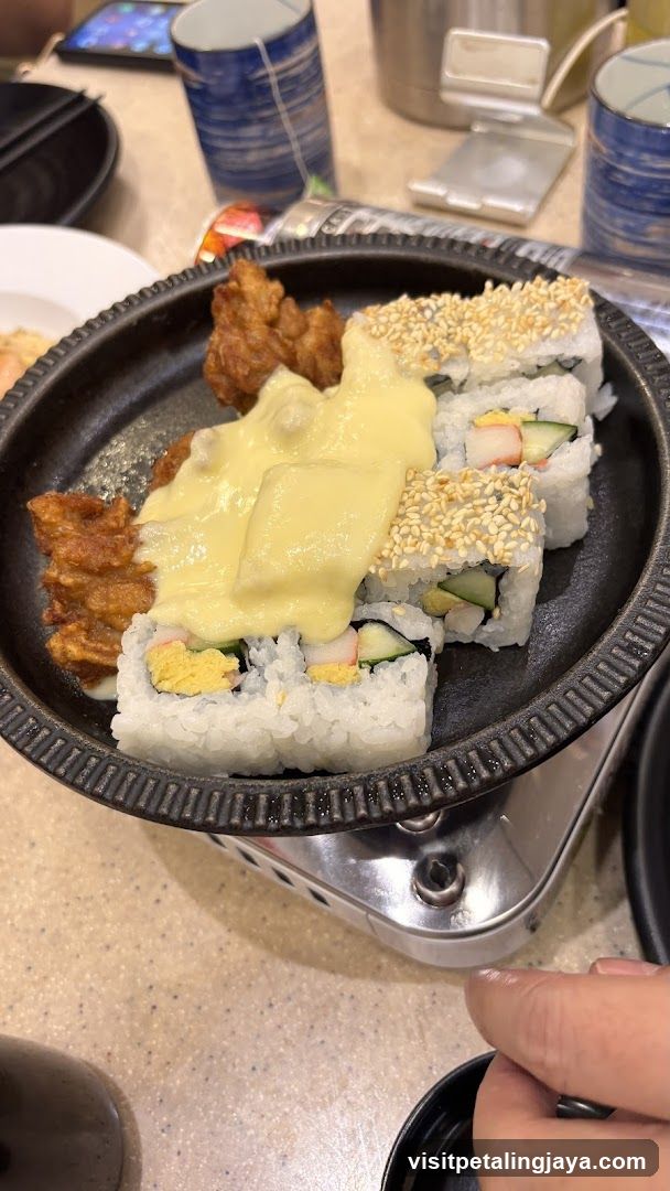 Sushi and Fried Chicken with Cheese Sauce