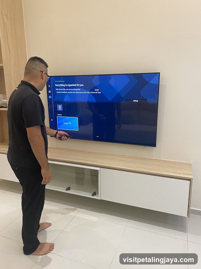 Man Setting Up Smart TV