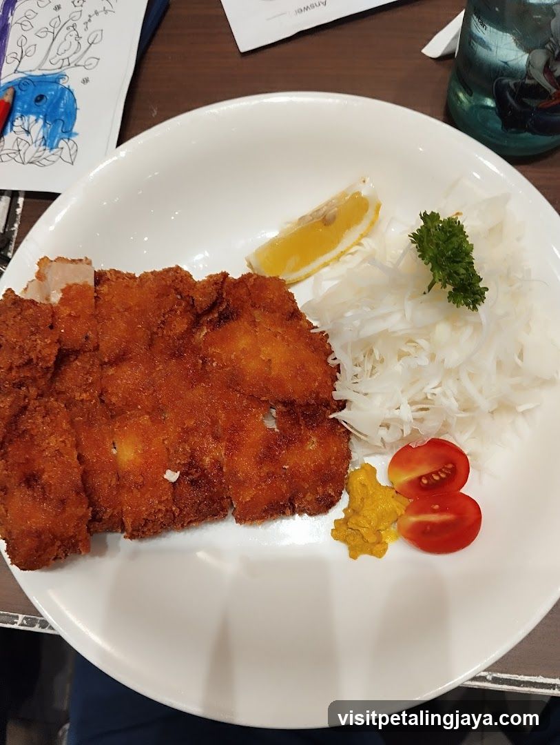 Breaded Cutlet with Sauerkraut and Tomato Slices