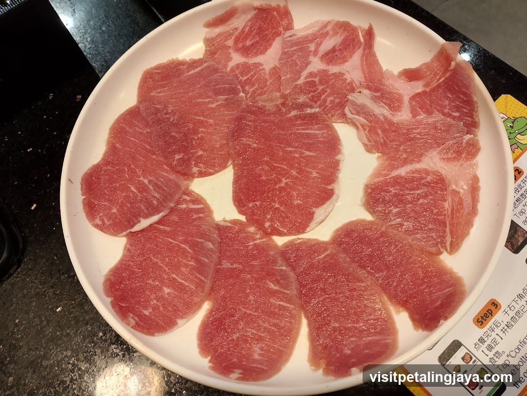 Raw Meat Slices on Plate