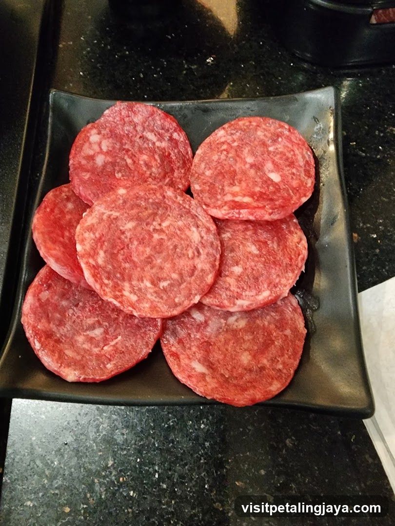 Sliced Meat on Black Plate